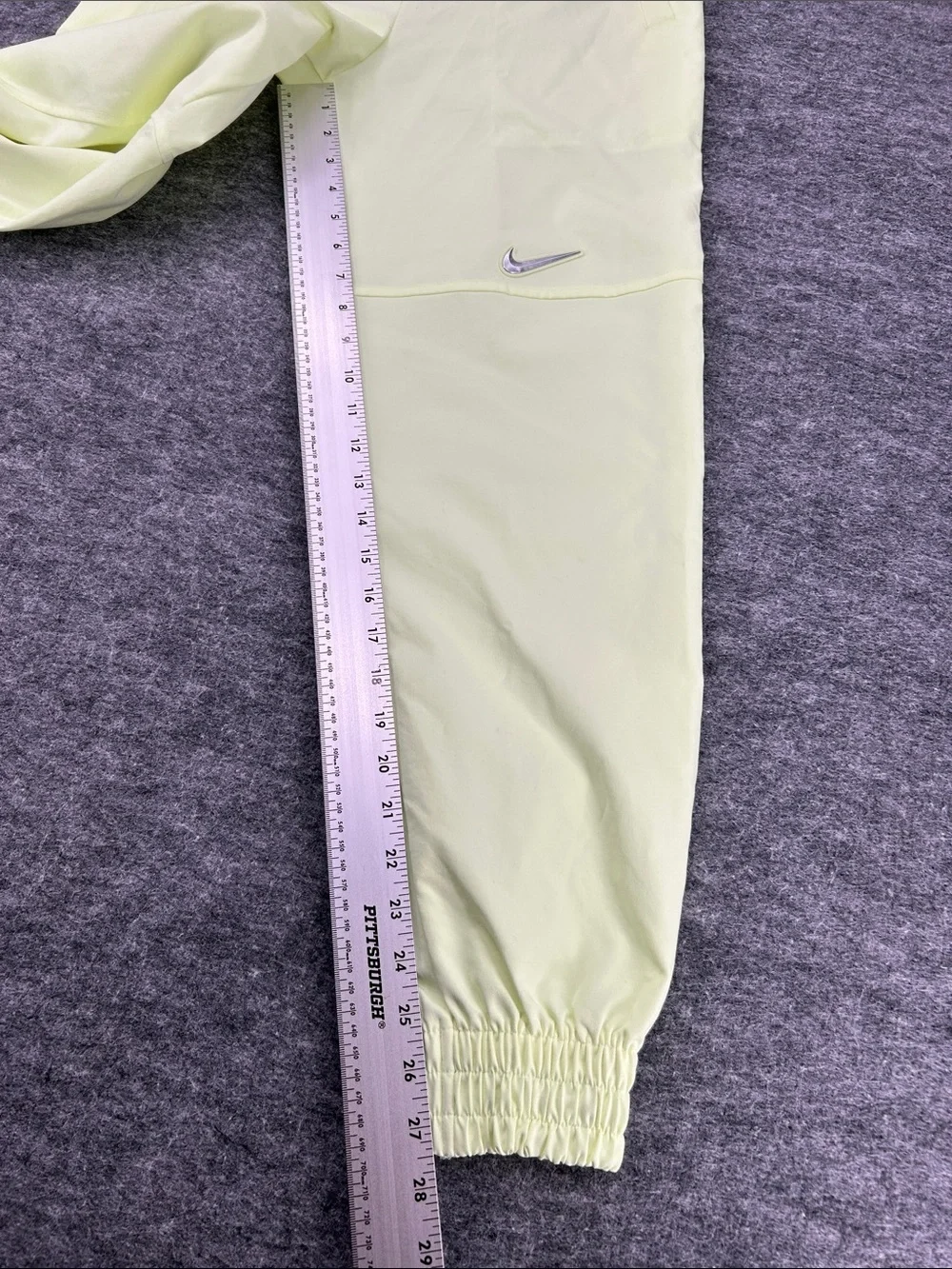Nike Women's Sportswear Woven Pants in a bright neon green/yellow XS